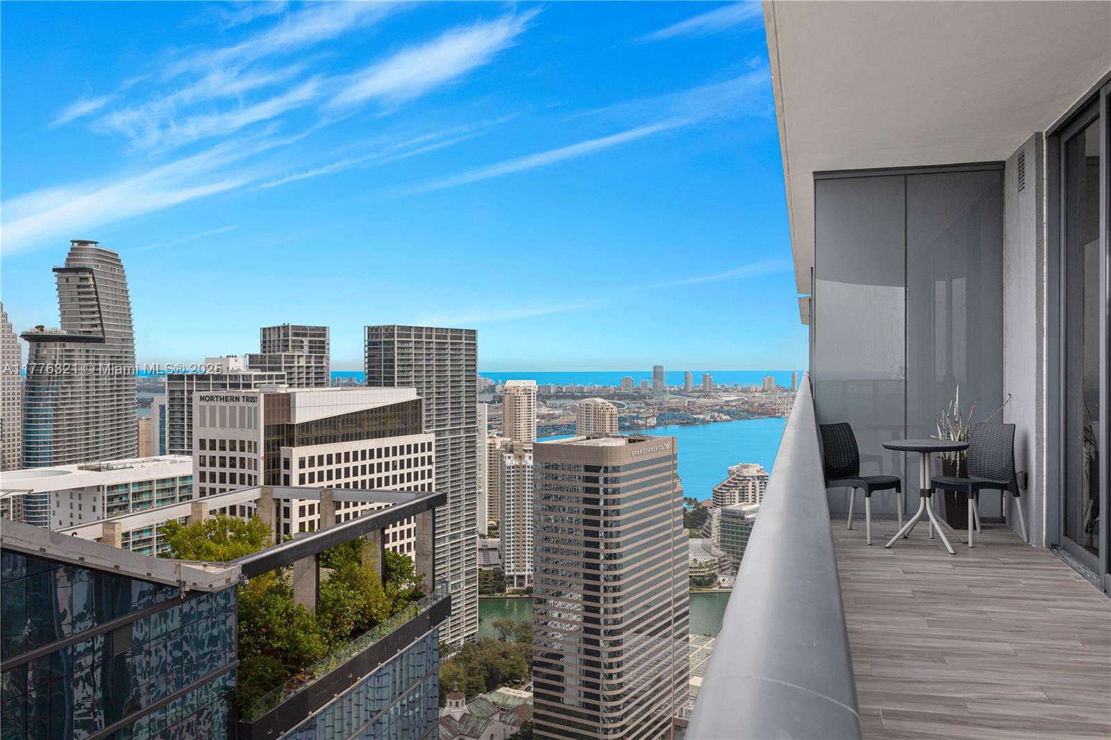 801 South Miami Avenue, Unit 5209 Miami, FL 33131 - Photo 2 of 43 a view of roof deck with two chairs and wooden floor