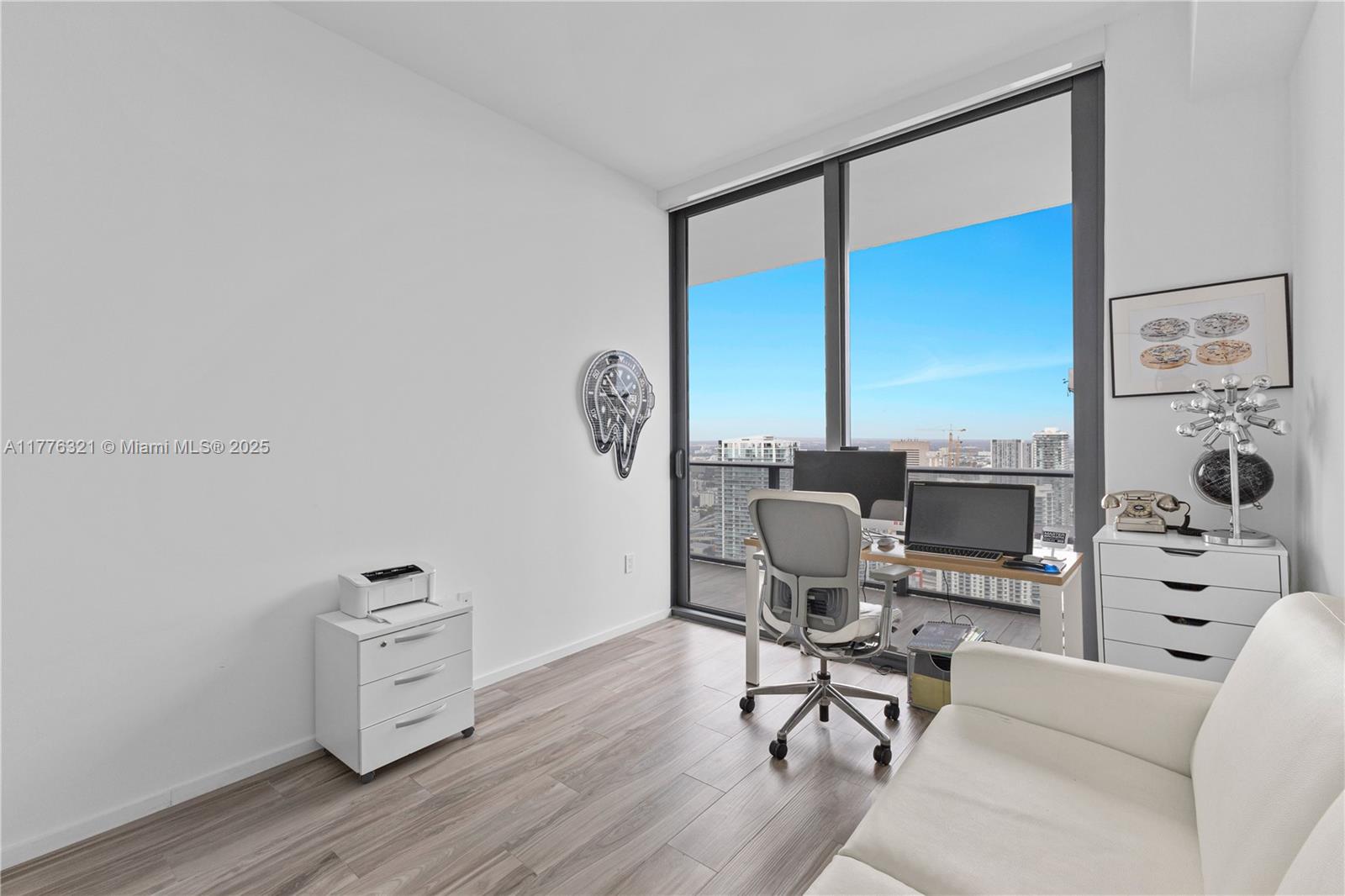 801 South Miami Avenue, Unit 5209 Miami, FL 33131 - Photo 26 of 43 a living room with furniture and a flat screen tv
