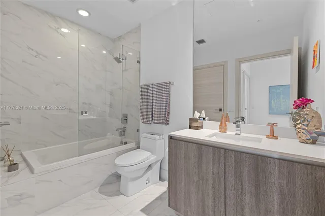 a close view of a utility room with washing machine