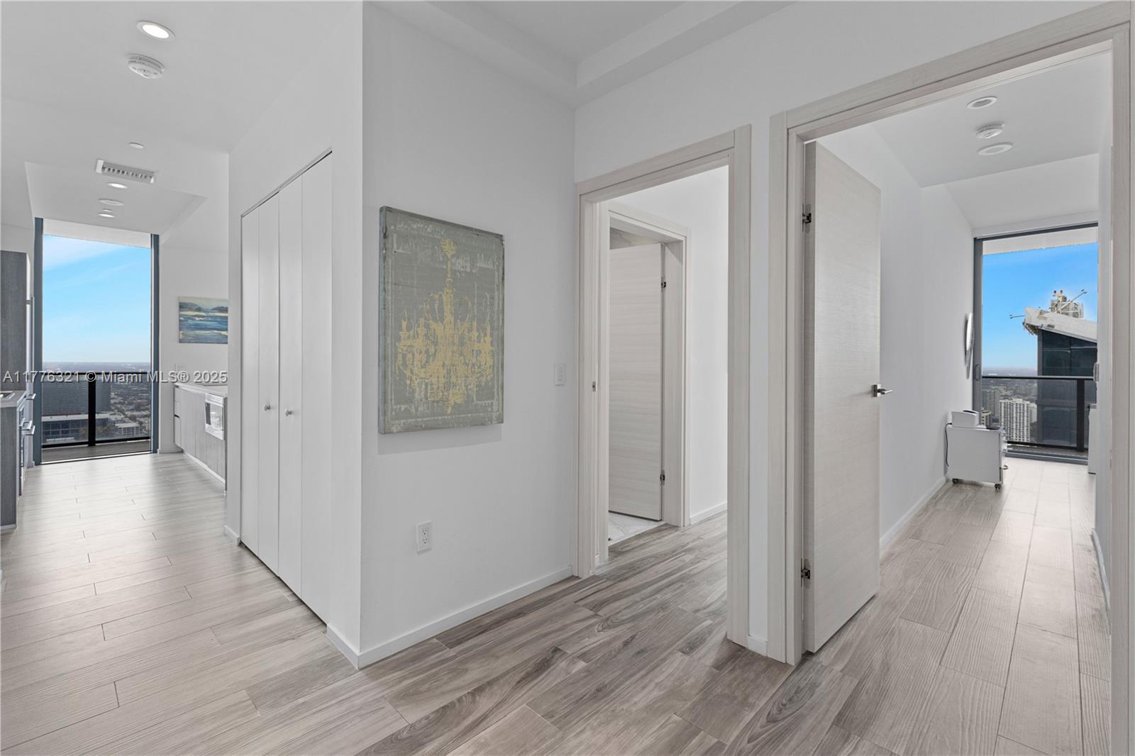 801 South Miami Avenue, Unit 5209 Miami, FL 33131 - Photo 30 of 43 a view of a hallway with wooden floor windows and livingroom view