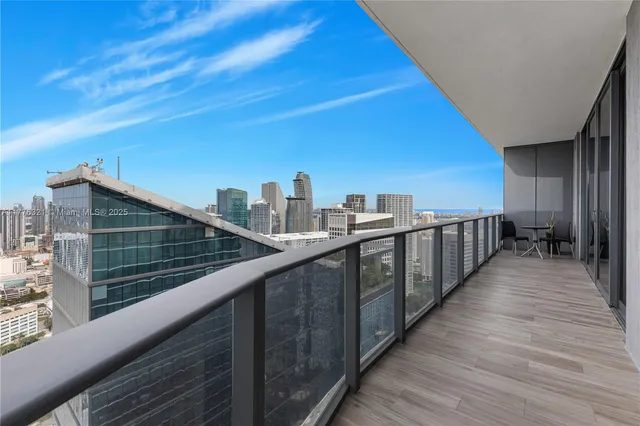 a view of small space with wooden floor and closet