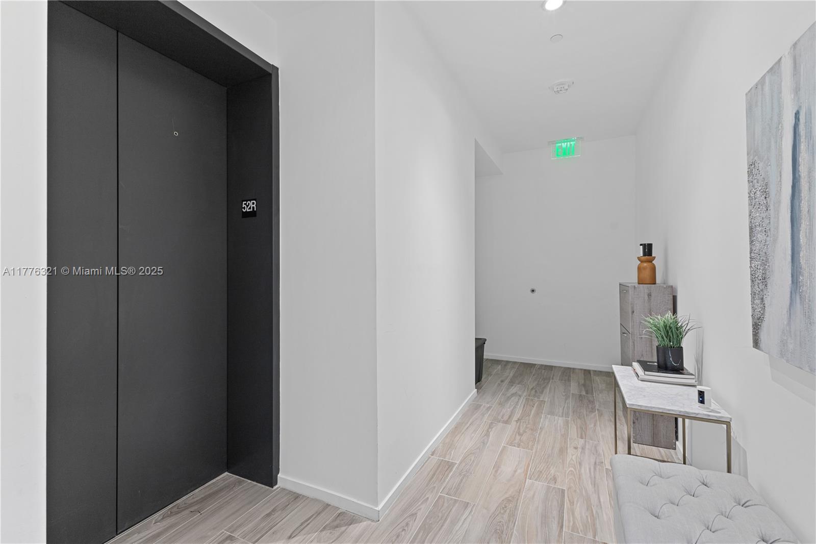 801 South Miami Avenue, Unit 5209 Miami, FL 33131 - Photo 33 of 43 a view of small space with wooden floor and closet