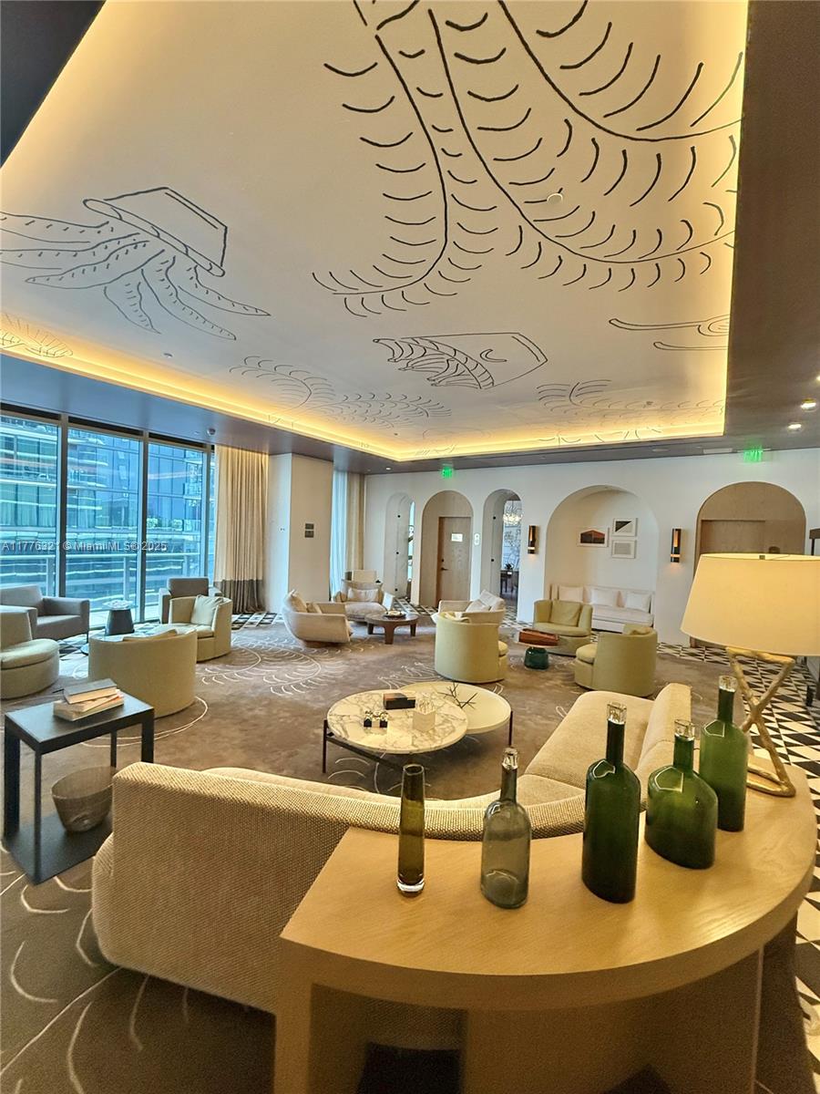 801 South Miami Avenue, Unit 5209 Miami, FL 33131 - Photo 38 of 43 a living room with furniture and a large window