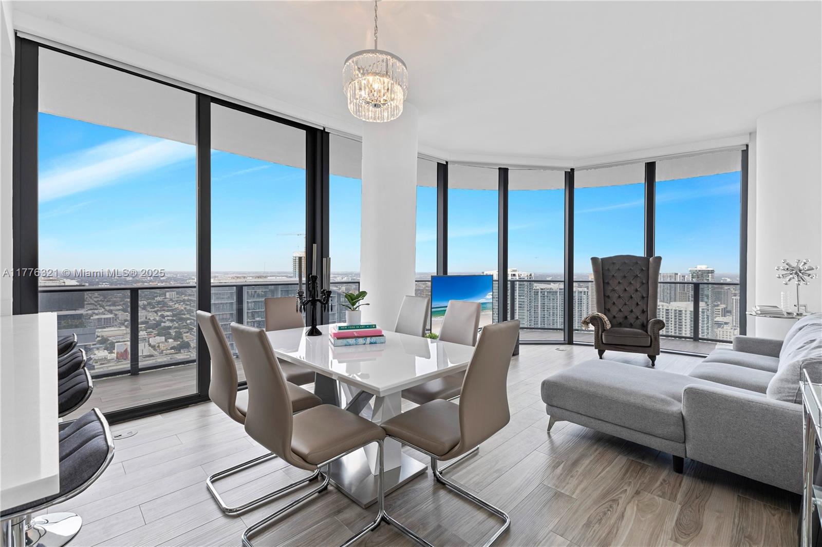 801 South Miami Avenue, Unit 5209 Miami, FL 33131 - Photo 4 of 43 a living room with furniture and floor to ceiling windows