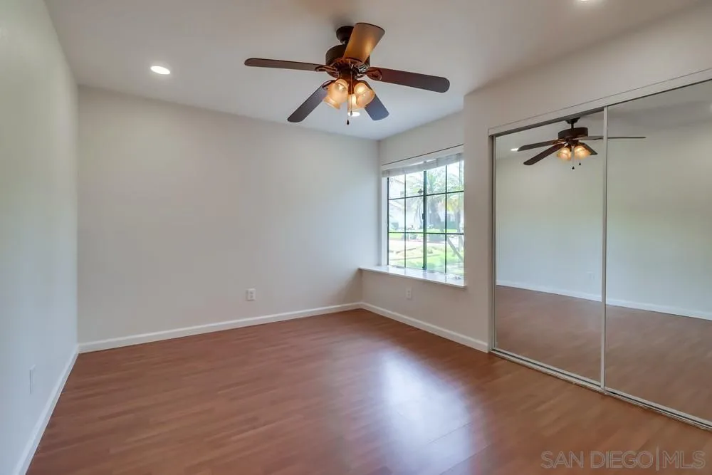 10310 Lake Ridge Court Spring Valley, CA 91977 - Photo 27 of 37 wooden floor in an empty room with a window
