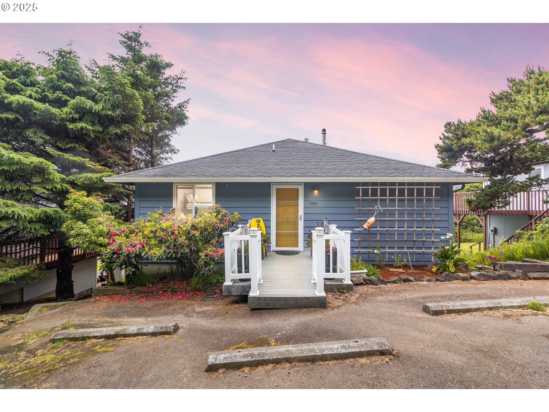 a front view of a house with garden