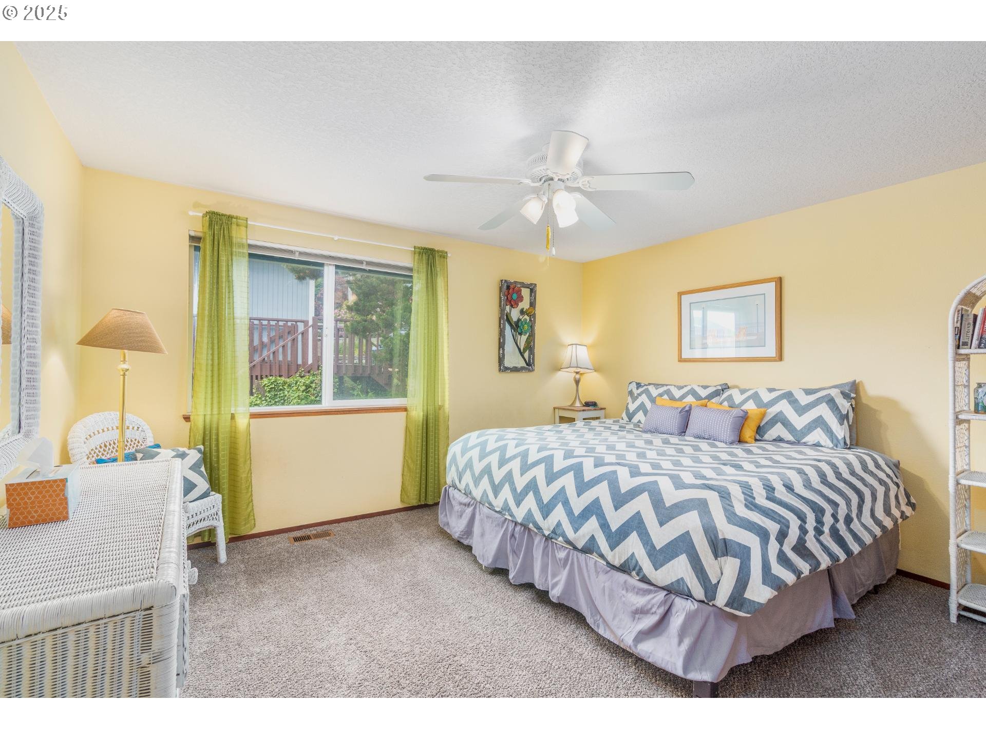 7495 Northeast Neptune Drive Lincoln City, OR 97367 - Photo 18 of 35 a bedroom with a large bed and a window