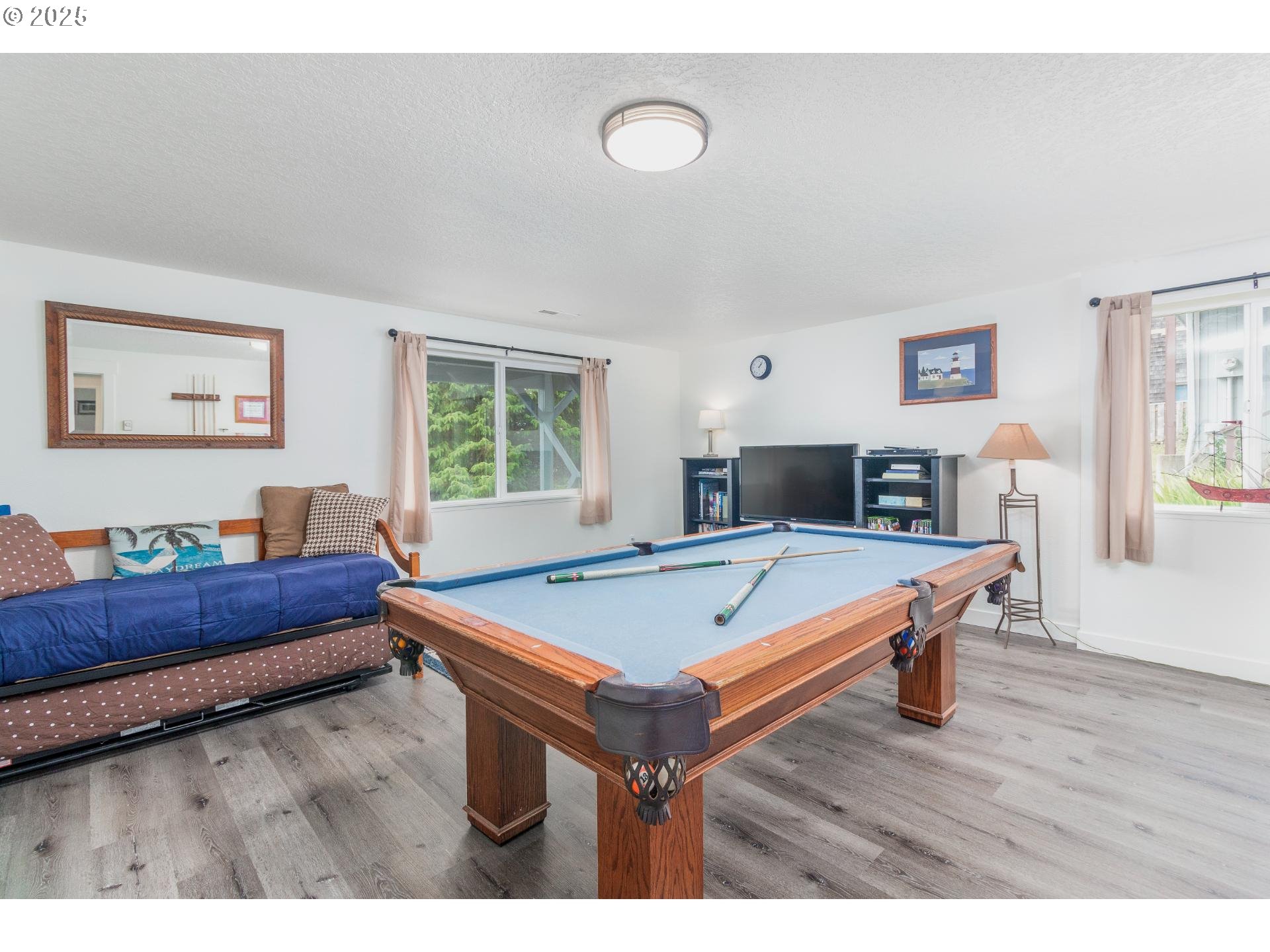 7495 Northeast Neptune Drive Lincoln City, OR 97367 - Photo 23 of 35 a living room with furniture and a table