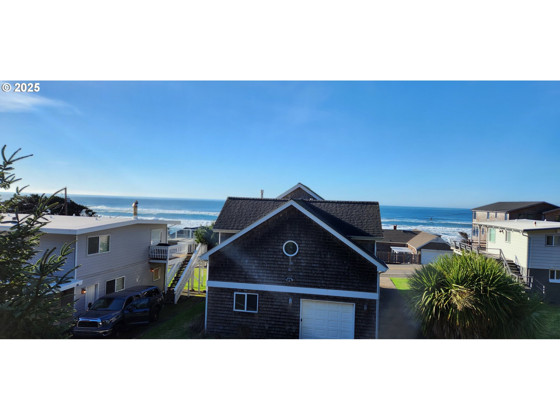 7495 Northeast Neptune Drive Lincoln City, OR 97367 - Photo 28 of 35 a black and white room with a small yard