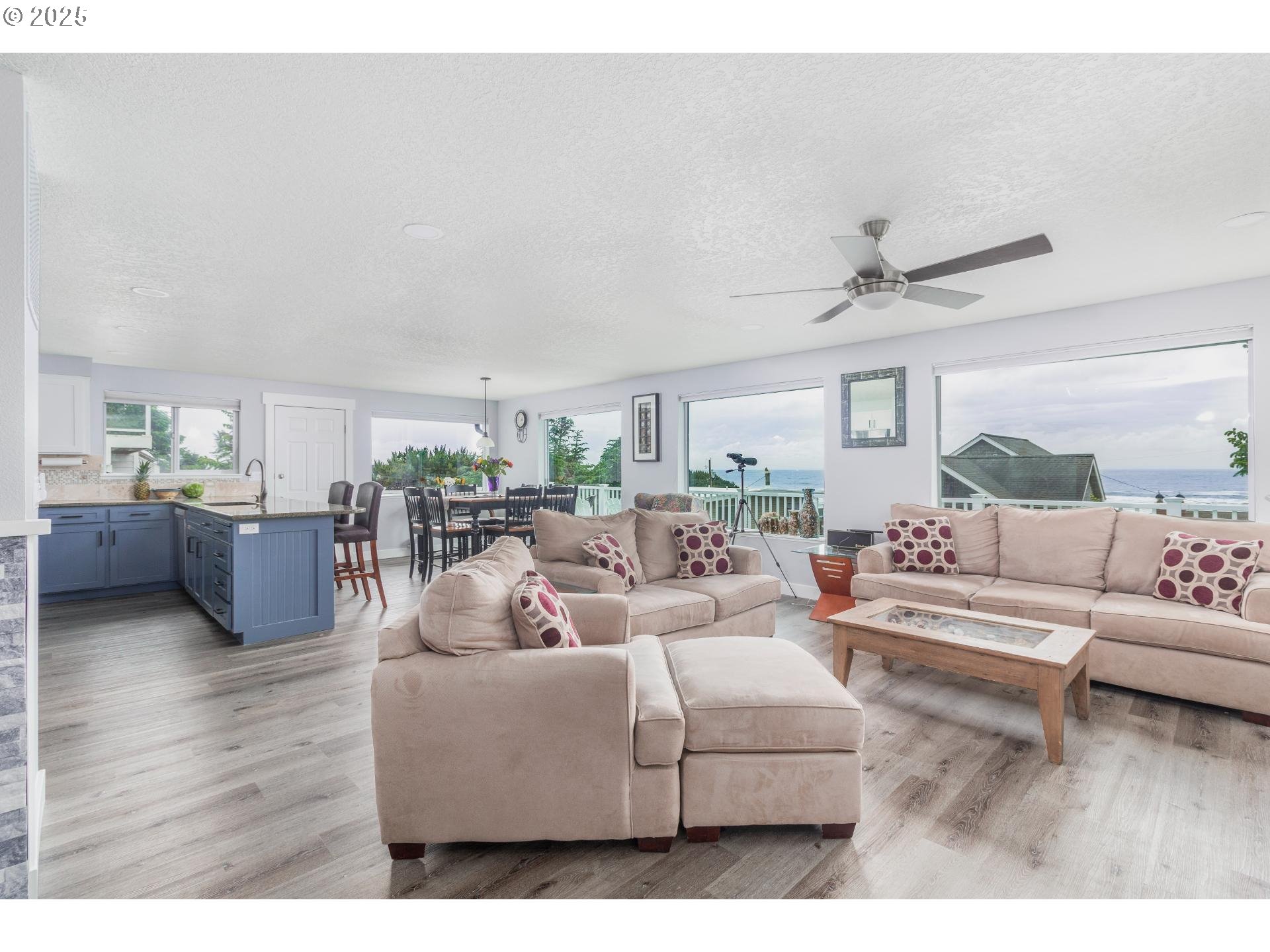 7495 Northeast Neptune Drive Lincoln City, OR 97367 - Photo 3 of 35 a living room with furniture and a large window