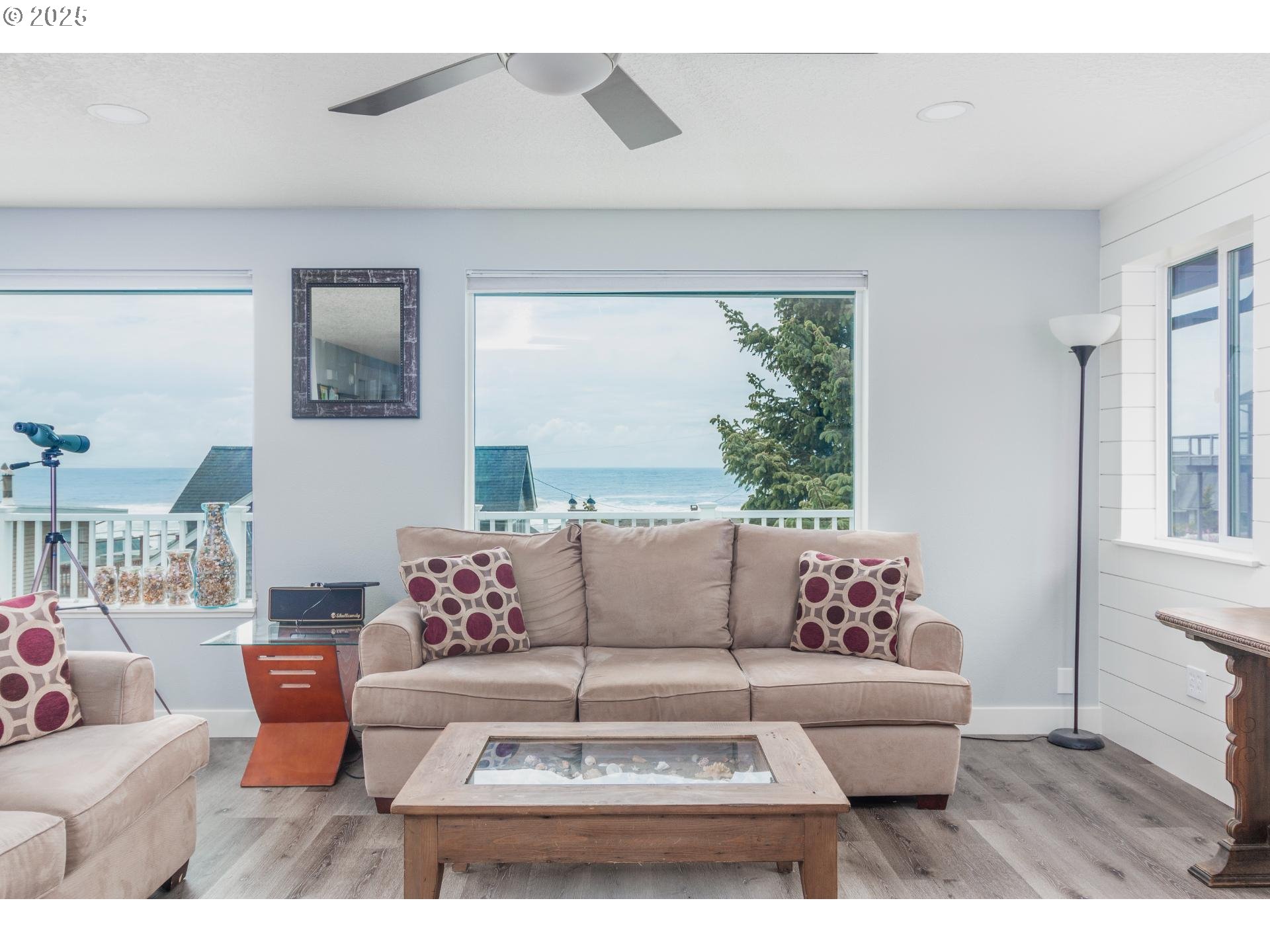 7495 Northeast Neptune Drive Lincoln City, OR 97367 - Photo 6 of 35 a living room with furniture and a large window