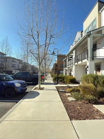 a view of a street with some cars on the road