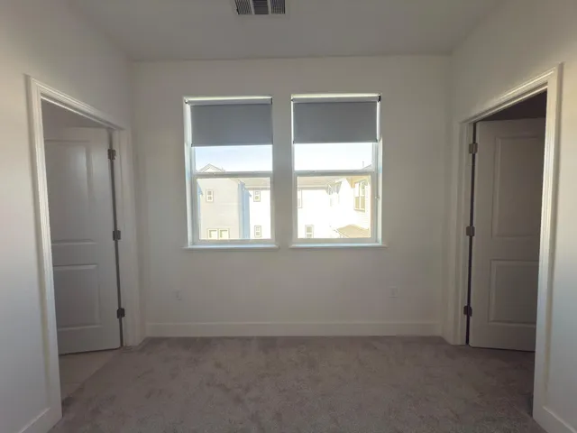 an empty room that has a window