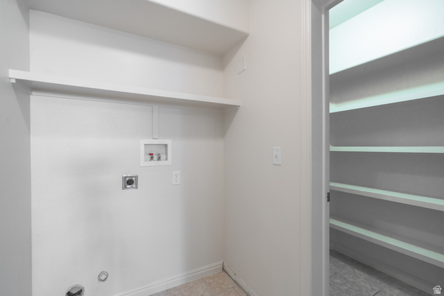 1735 West 540 North, Unit 1805 St. George, UT 84770 - Photo 27 of 64 Dedicated laundry area featuring hookups for appliances, an upper storage shelf, and light-toned wall paint