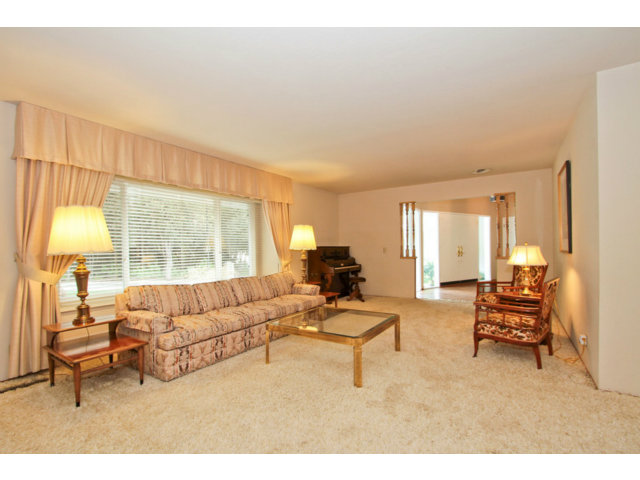 7120 Echo Loop San Jose, CA 95120 - Photo 5 of 25 a living room with furniture and a large window