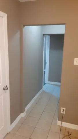 a kitchen with granite countertop a stove a sink and a microwave