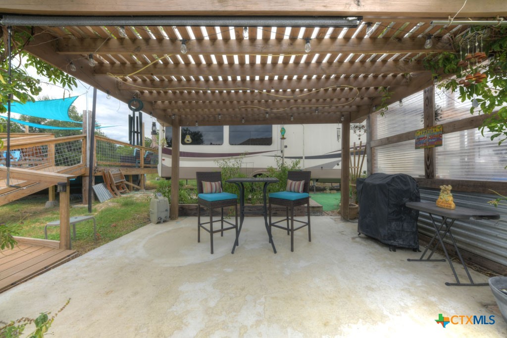 861 Rutherford Fischer, TX 78623 - Photo 20 of 38 Additional outdoor covered seating area near RV pad site.