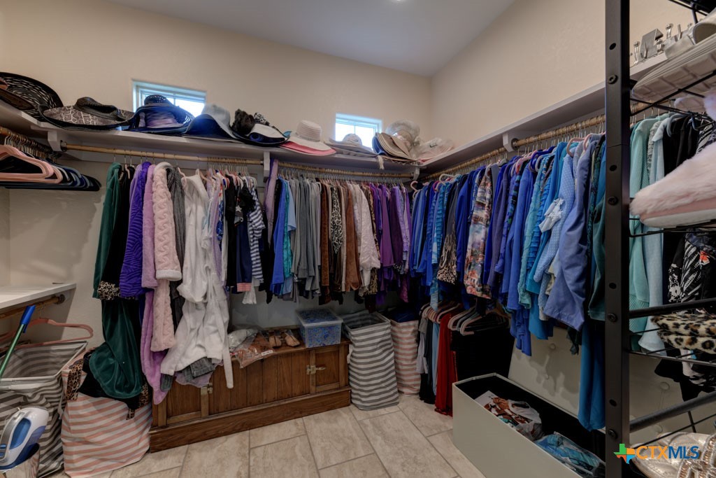 861 Rutherford Fischer, TX 78623 - Photo 29 of 38 Spacious Primary bedroom closet. Additional closet space can be found in main hallway as well.