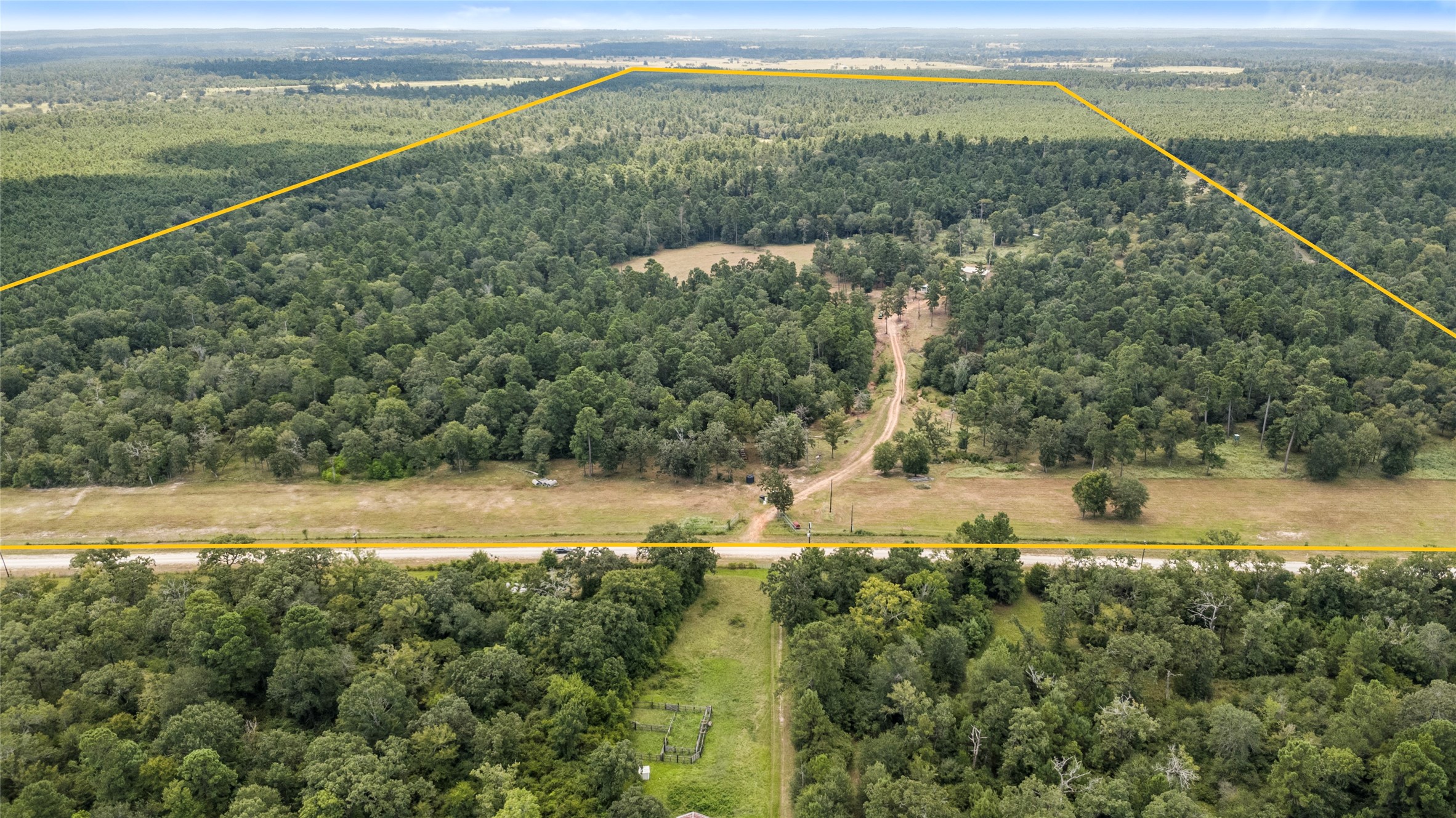 235 Flynt Road Huntsville, TX 77320 - Photo 14 of 25 a view of a lake with a mountain