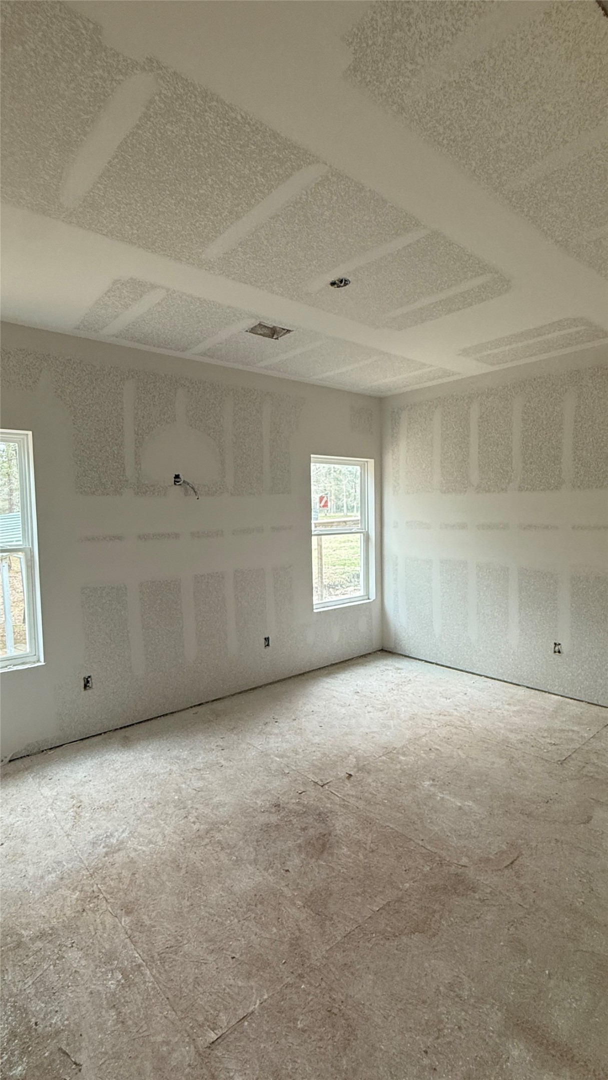 235 Flynt Road Huntsville, TX 77320 - Photo 7 of 25 a view of an empty room with a window