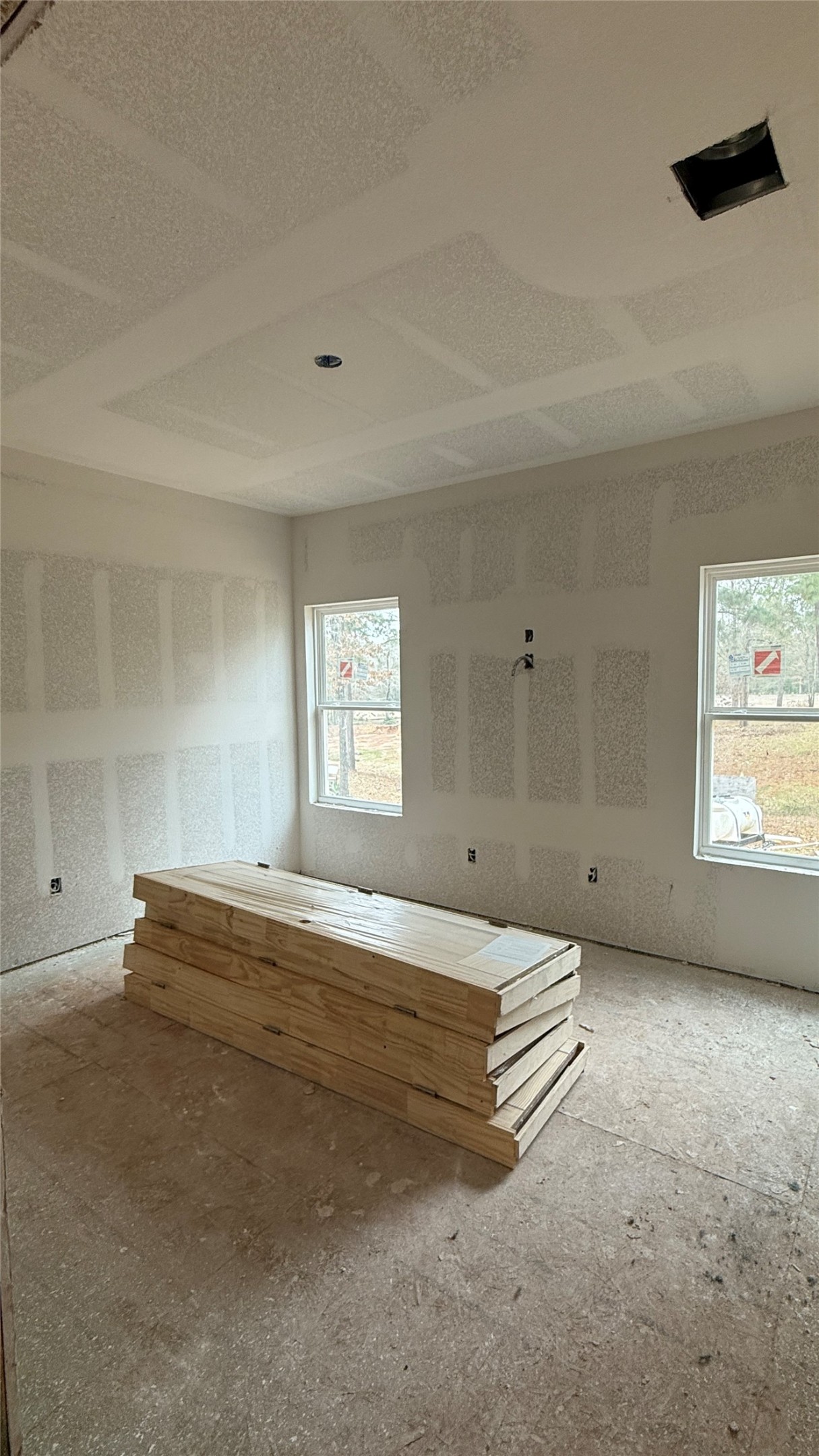 235 Flynt Road Huntsville, TX 77320 - Photo 8 of 25 a view of a big room with windows