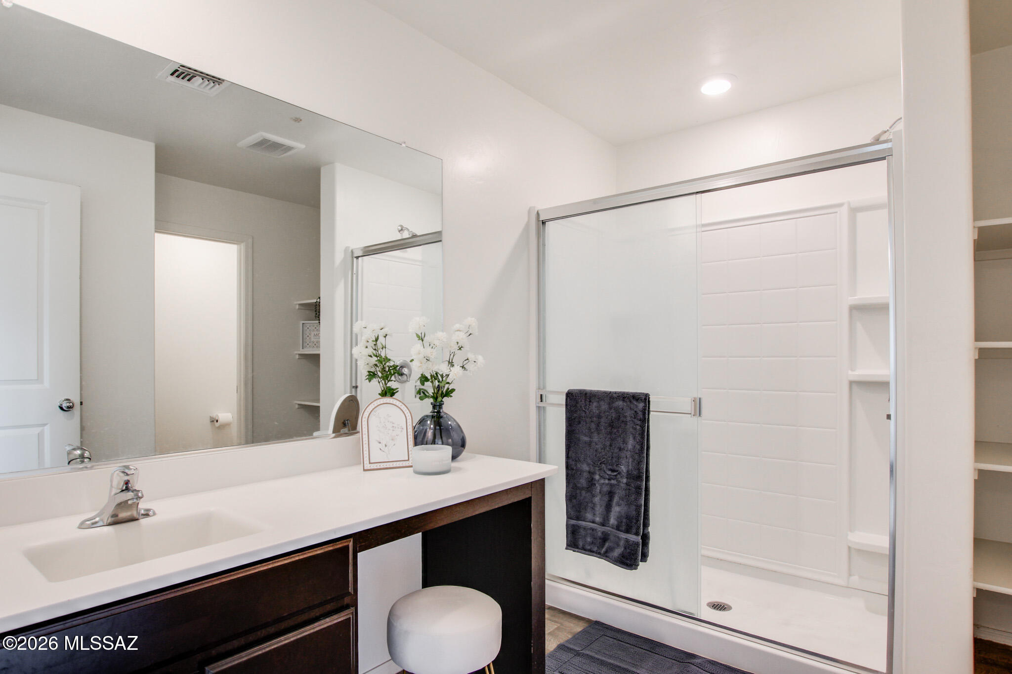 5987 South Antrim Loop Tucson, AZ 85706 - Photo 23 of 34 a bathroom with a granite countertop sink a mirror and shower