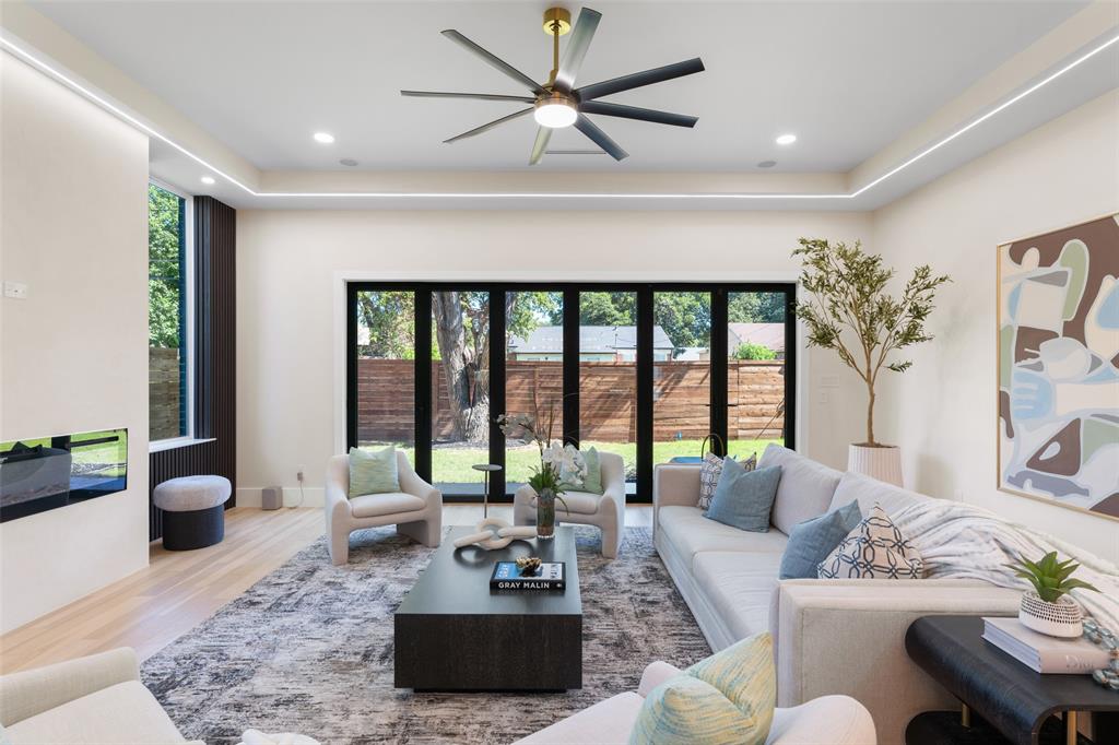 4717 Linnet Lane Dallas, TX 75209 - Photo 11 of 39 a living room with furniture and a large window