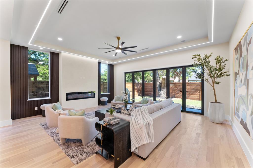 4717 Linnet Lane Dallas, TX 75209 - Photo 12 of 39 a living room with furniture and large windows
