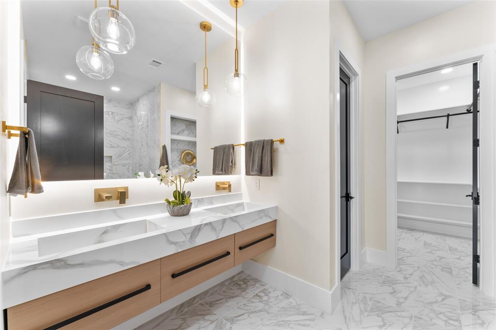 4717 Linnet Lane Dallas, TX 75209 - Photo 14 of 39 a bathroom with a sink and a mirror