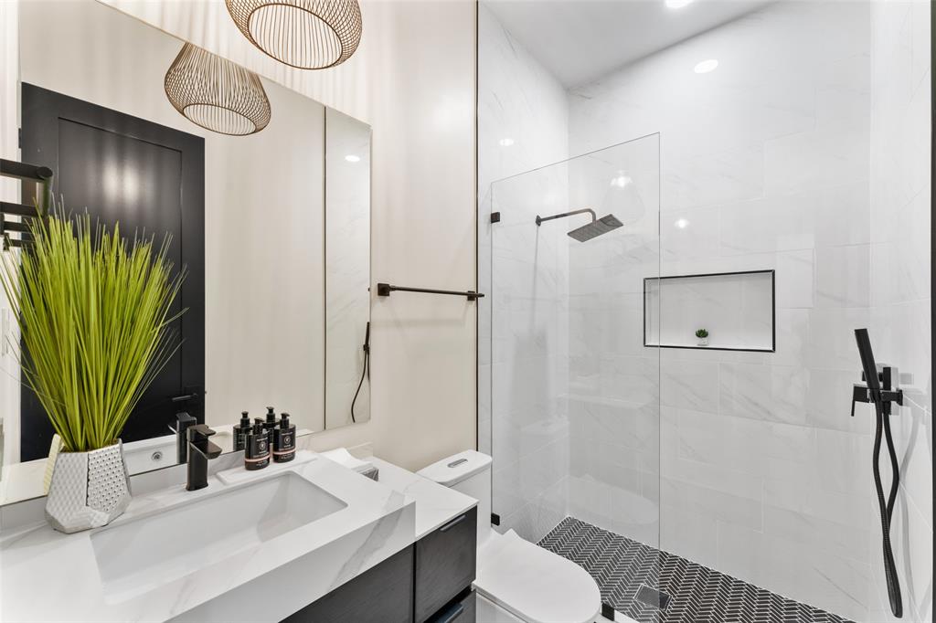 4717 Linnet Lane Dallas, TX 75209 - Photo 19 of 39 a bathroom with a sink toilet and shower