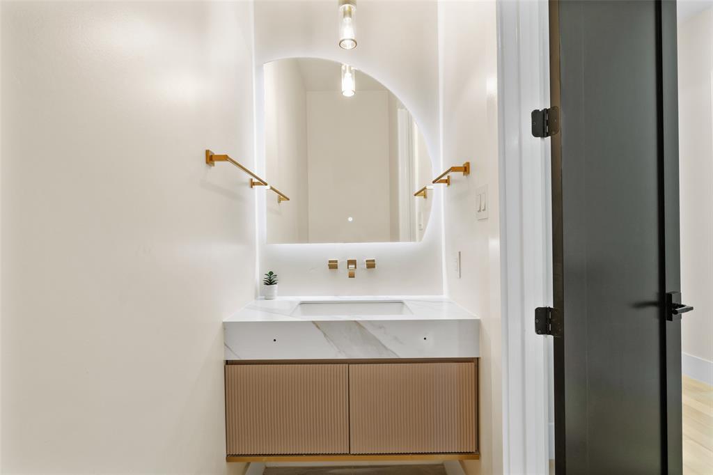 4717 Linnet Lane Dallas, TX 75209 - Photo 20 of 39 a bathroom with a sink and a mirror