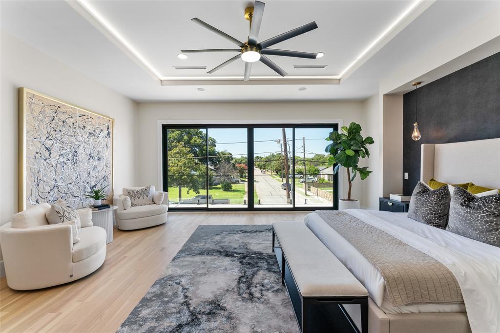 4717 Linnet Lane Dallas, TX 75209 - Photo 23 of 39 a bedroom with a large bed and a large window