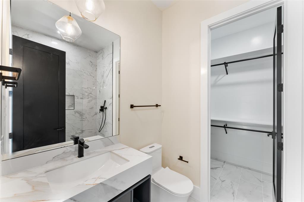 4717 Linnet Lane Dallas, TX 75209 - Photo 29 of 39 a bathroom with a sink toilet and shower