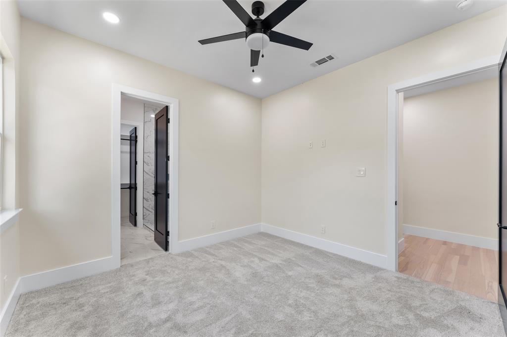 4717 Linnet Lane Dallas, TX 75209 - Photo 31 of 39 an empty room with a ceiling fan and window