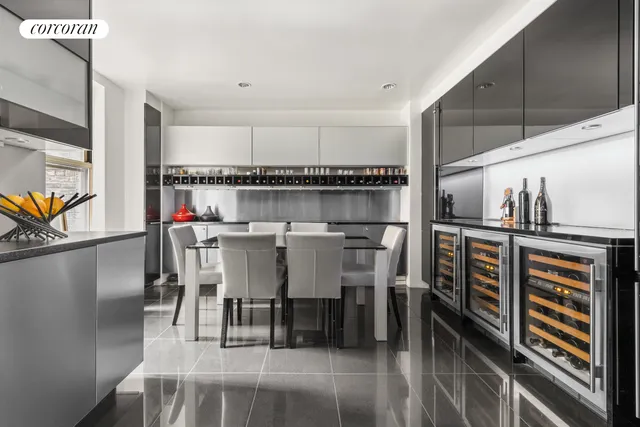 a kitchen with granite countertop a sink stainless steel appliances and cabinets