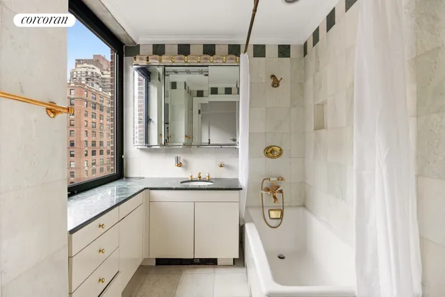 a bedroom with a large bed and a large window