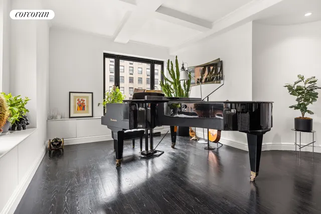 a living room with fireplace furniture and a wooden floor