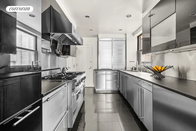 a room with dining table and chairs