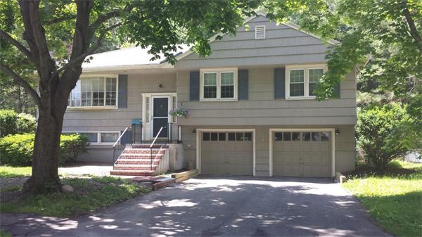 97 Sutton Road Needham, MA 02492 - Photo 1 of 11 a front view of a house with a yard