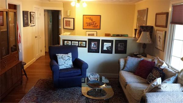 97 Sutton Road Needham, MA 02492 - Photo 2 of 11 a living room with furniture and a fireplace
