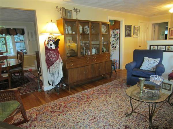 97 Sutton Road Needham, MA 02492 - Photo 3 of 11 a living room with furniture a rug and white walls