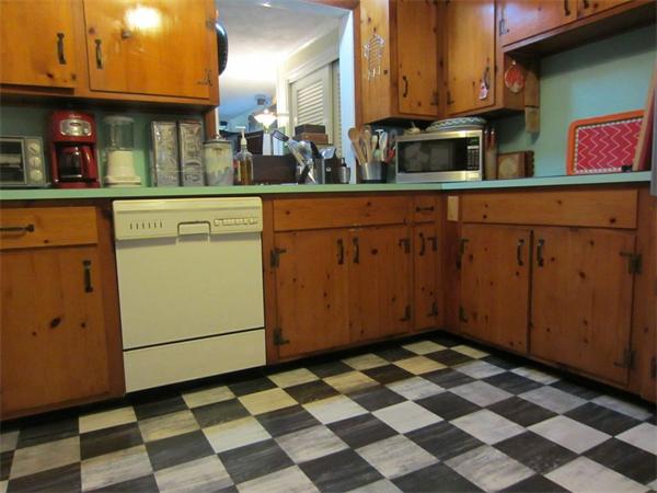97 Sutton Road Needham, MA 02492 - Photo 6 of 11 a kitchen with stainless steel appliances granite countertop cabinets and a counter top