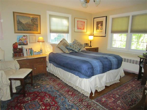 97 Sutton Road Needham, MA 02492 - Photo 9 of 11 a bedroom with a bed and wooden floor