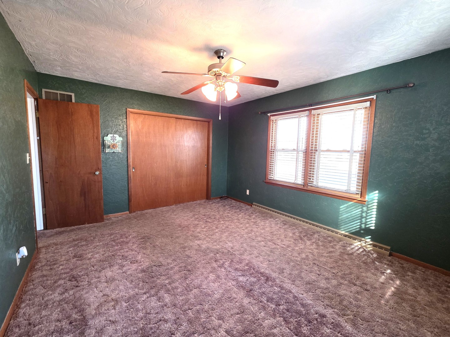 524 East Chestnut Street Geneseo, IL 61254 - Photo 14 of 39 a view of an empty room with window and chandelier fan
