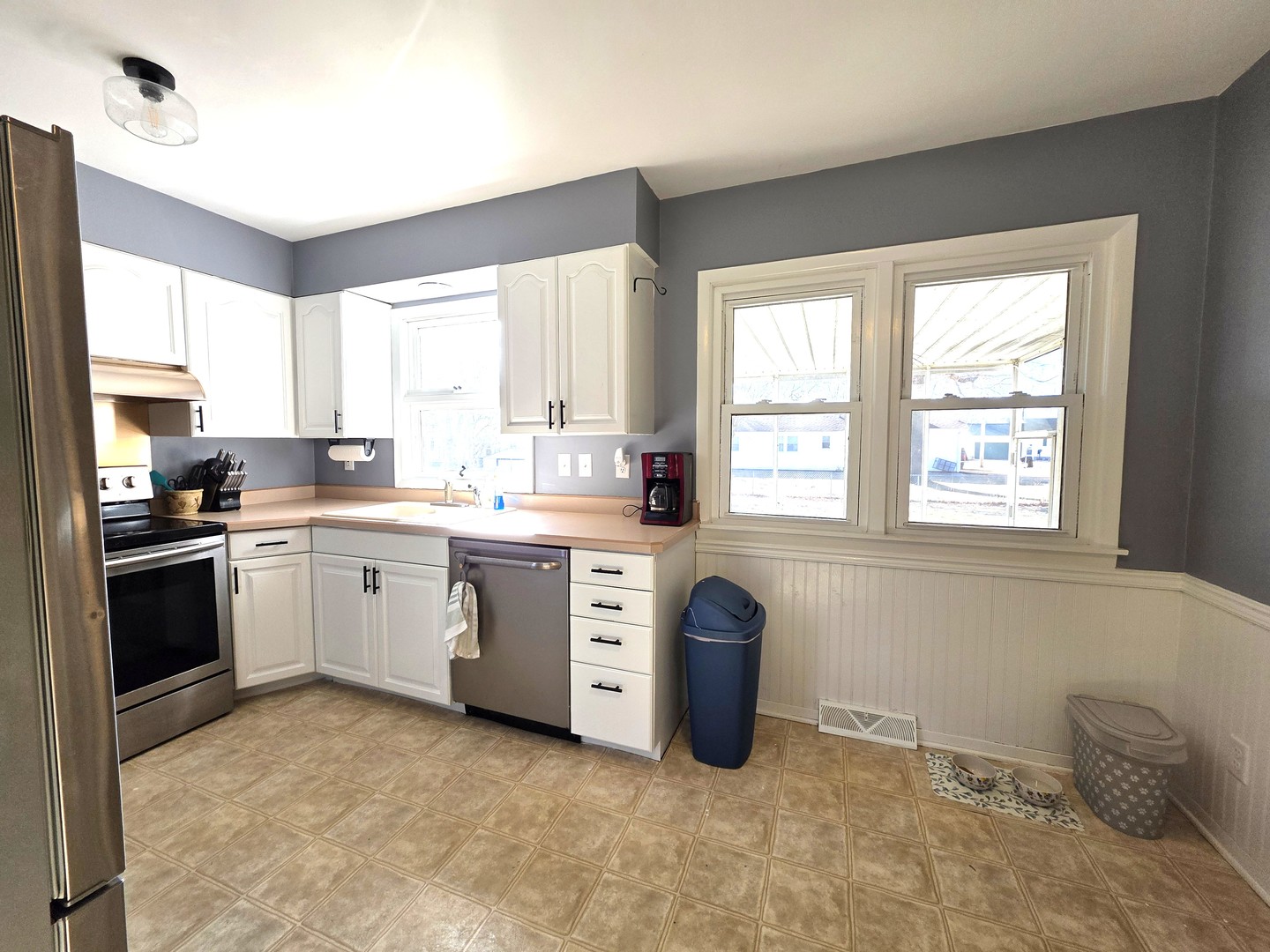 524 East Chestnut Street Geneseo, IL 61254 - Photo 22 of 39 a kitchen with a stove a sink and a window