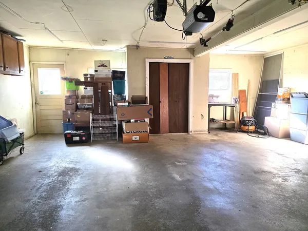a view of a room with furniture and a window
