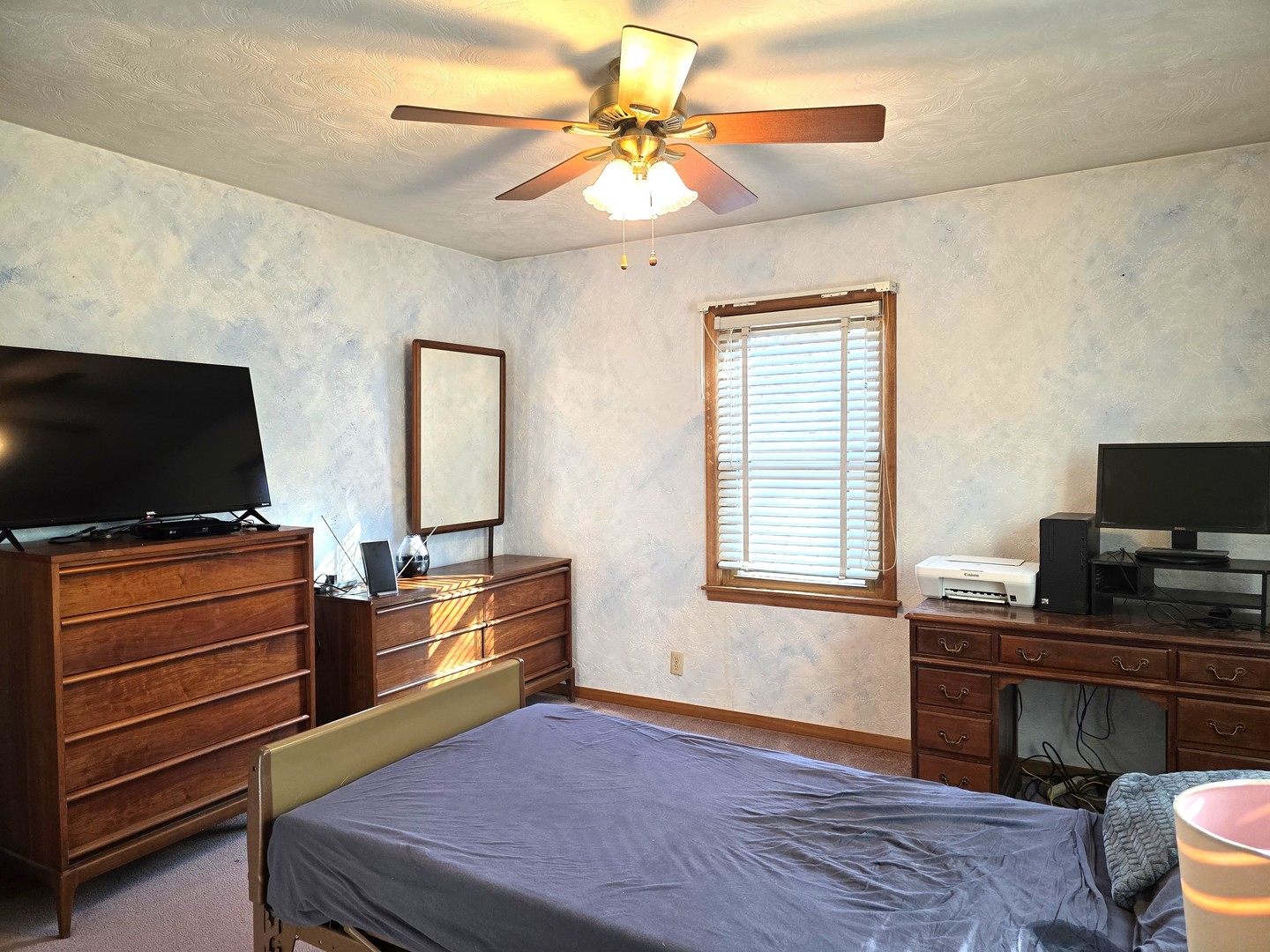 524 East Chestnut Street Geneseo, IL 61254 - Photo 10 of 39 a bedroom with furniture and a flat screen tv