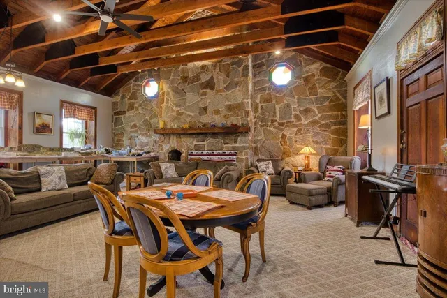 a dining room with furniture and a chandelier