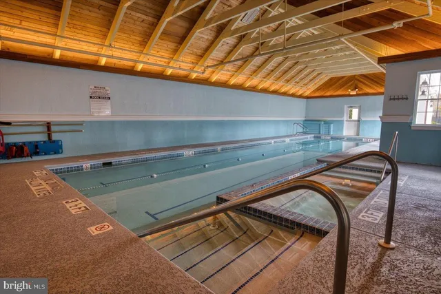 a kitchen with stainless steel appliances granite countertop a refrigerator a stove and a sink