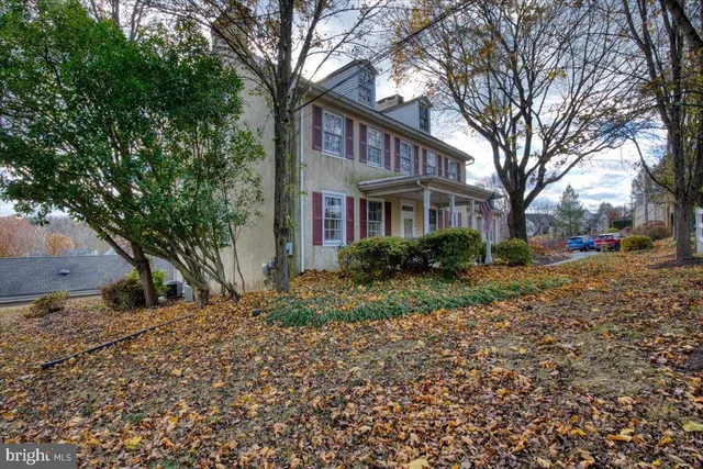 a house that has a tree in front of it